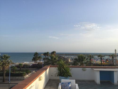 a view of the ocean from the balcony of a resort at L'Approdo in San Leone