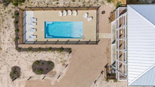 an overhead view of a swimming pool on the beach at The Sea Salt Sandcastle in St. George Island