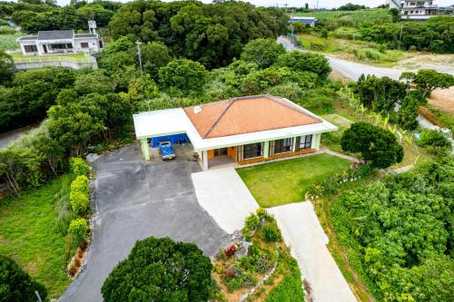 an overhead view of a house with a roof at Ocean View House Nakijin in Nakijin
