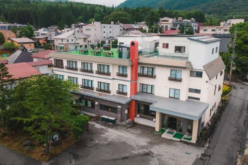 an aerial view of a building in a city at Summit Views Hakuba in Hakuba
