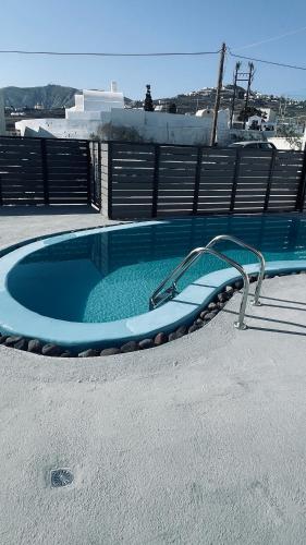 a jacuzzi tub on top of a building at Aliki's Apartments in Vóthon