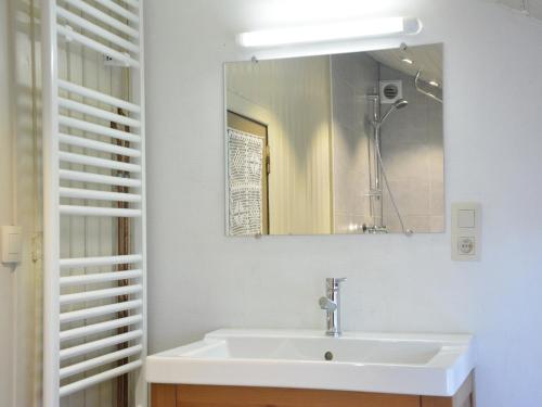 a bathroom with a sink and a mirror at Nice gite with low ceilings in Han-sur-Lesse in Han-sur-Lesse
