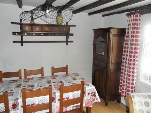a dining room with a table and a chandelier at Nice gite with low ceilings in Han-sur-Lesse in Han-sur-Lesse