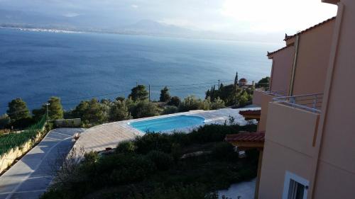 a view of the ocean from a building at Aegean View Villa in Loutraki