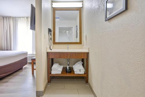 a bathroom with a sink in a hotel room at Comfort Inn & Suites Montgomery East Carmichael Rd in Montgomery
