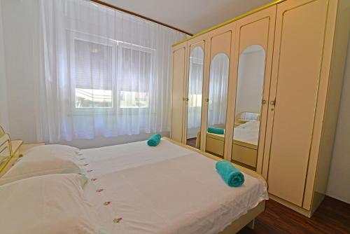 A bed or beds in a room at Apartment Nevena