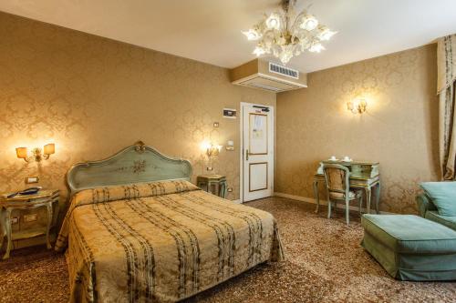 Ένα ή περισσότερα κρεβάτια σε δωμάτιο στο Locanda Barbarigo