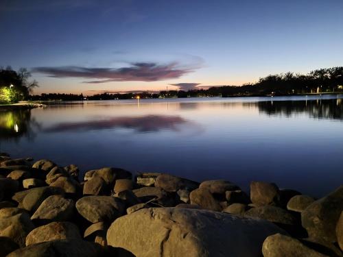 a large body of water with rocks in it at Centrally Located Southside Private Basement Suite in Lethbridge