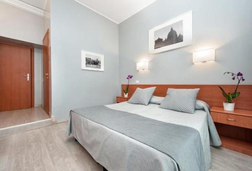 Cama o camas de una habitación en Reyes Suite & Rooms
