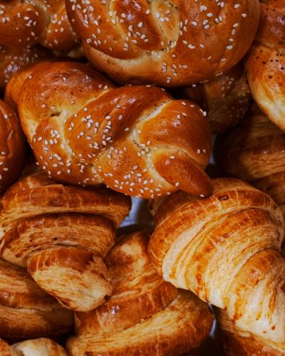 a pile of pretzels and croissants are shown at Omar Khayyam Hotel in Bukhara