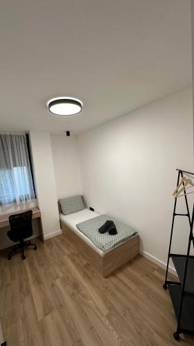 a room with a bed and a desk in it at District 21 in Belgrade