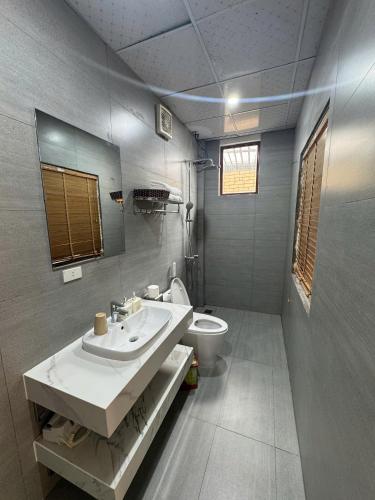 a bathroom with a sink and a toilet at Tam Coc Rocky Bungalow in Ninh Binh
