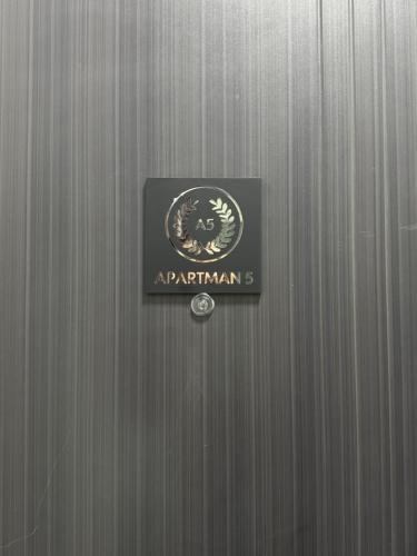 a metal door with a sign on it at RS Apartmani in Belgrade