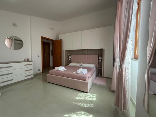 Postel nebo postele na pokoji v ubytování La Casa Di Elda