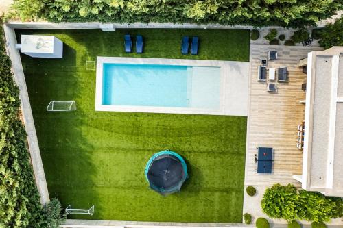 an overhead view of a swimming pool on a lawn at Goudi Residence in Goudhi