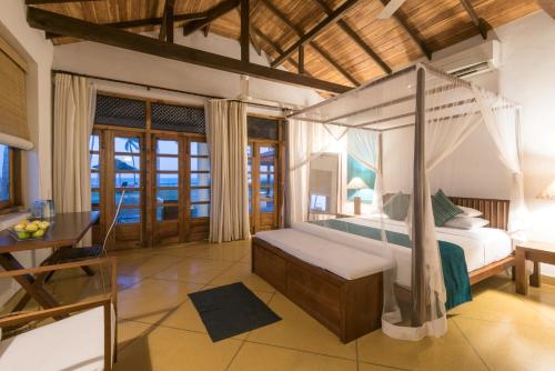 Tempat tidur dalam kamar di Kottukal Beach House by Jetwing