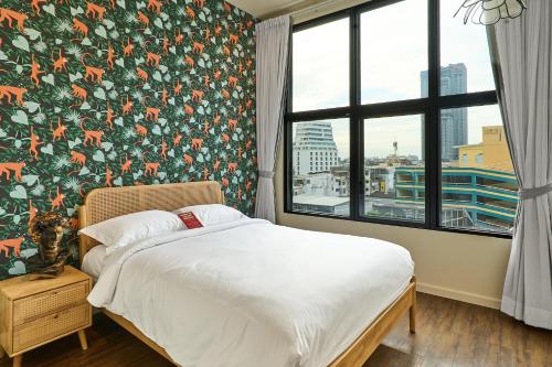 Ένα ή περισσότερα κρεβάτια σε δωμάτιο στο 5loft Anti-Hotel, Silom, Bangkok