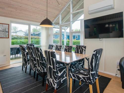 a dining room with a table and chairs at 12 person holiday home in Aabenraa-By Traum in Loddenhøj