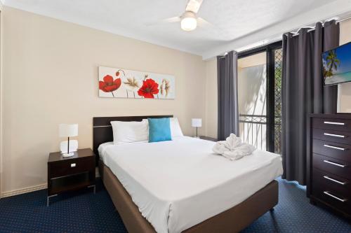 En eller flere senge i et værelse på Turtle Beach 233