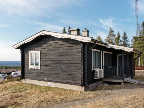 a small black house sitting on top of a hill at 6 person holiday home in KOPPARBERG-By Traum in Kopparberg