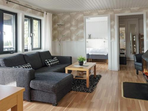 a living room with a couch and a table at 6 person holiday home in Kopparberg in Kopparberg