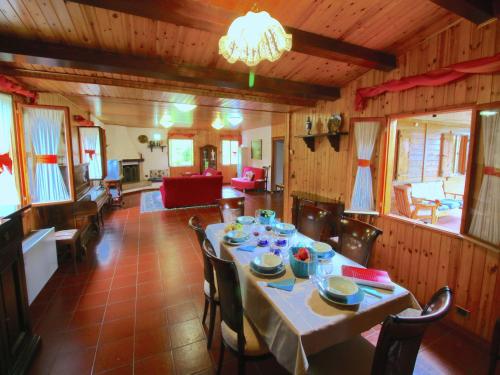 a dining room with a table and chairs at Chalet in Umbria with Private Pool in Città di Castello