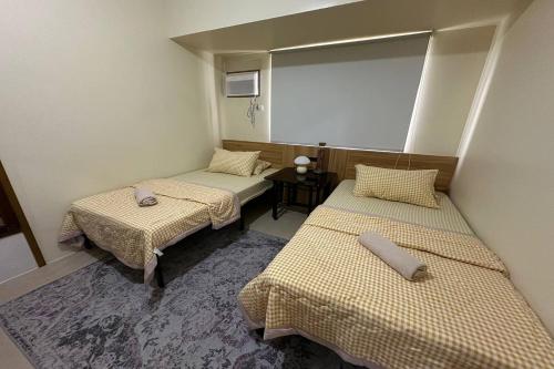 Postel nebo postele na pokoji v ubytování Avida Units