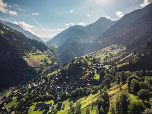 an aerial view of a valley with mountains at Cozy Stay near Aletsch in Grengiols