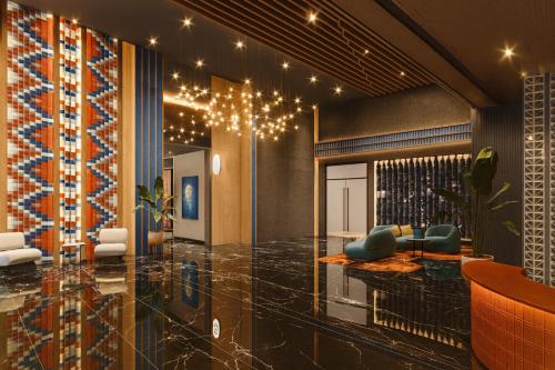 a lobby with a table and chairs and lights at MAJESTIC RESlDENCE KLCC in Kuala Lumpur