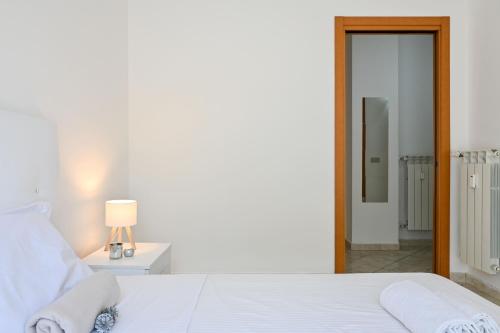 Postel nebo postele na pokoji v ubytování Inn Pisa Rentals - Urban style Pisa Flat