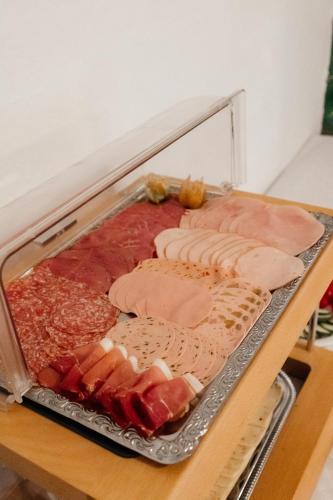 a tray of different types of meats and cheese at Pension Zschirnsteinbaude in Kleingießhübel