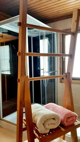 a wooden bunk bed in a room with a mirror at Casas de Montanha da Gralheira in Gralheira