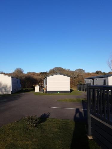 a view of a parking lot with a white building at Serenity in Saint Erth