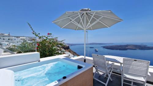 a hot tub and a chair and an umbrella at Karpimo Horizon - Caldera View with private hot tub in Firostefani