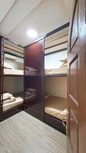 an open door to a room with bunk beds at North House in Tây Ninh