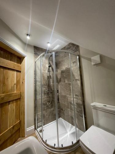 a bathroom with a shower and a toilet at Roseberry View Barn, Northallerton in Northallerton