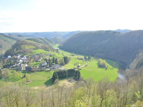 a small village in a green valley with a river at Forest Cottage, Jehonville in Jehonville