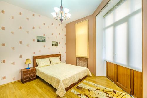 Llit o llits en una habitació de CUBAR Apartment
