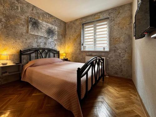 Postel nebo postele na pokoji v ubytování Apartman Lora