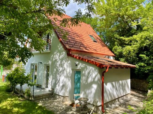 a white house with an orange roof at Cozy little hideaway in Balatonfüred