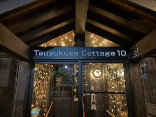 a building with a sign that reads tivolika college at Tsuyukusa in Takayama