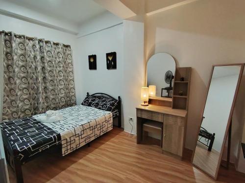 Postel nebo postele na pokoji v ubytování Magoncia Condo Feel at Home and Enjoy Vacation