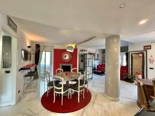 a kitchen and living room with a table and chairs at Penthouse Luxe - Rome in Rome