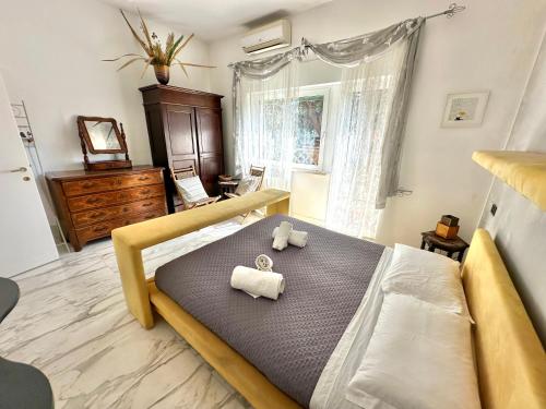 a bedroom with a bed with two towels on it at Penthouse Luxe - Rome in Rome