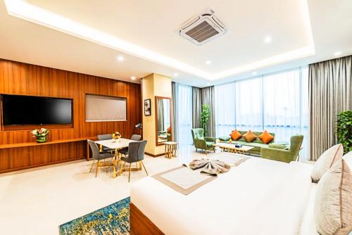 a hotel room with a bed and a living room at Sunday Luxury Central formerly Anan hotel in Riyadh