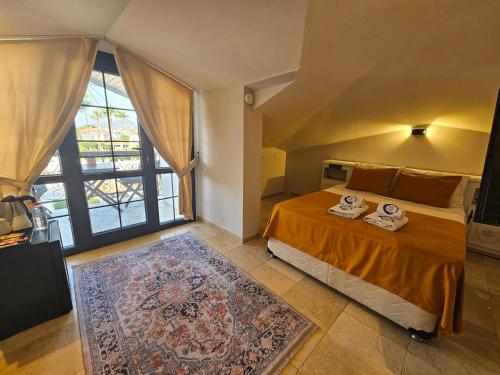 Ένα ή περισσότερα κρεβάτια σε δωμάτιο στο B&B Boutique Hotel