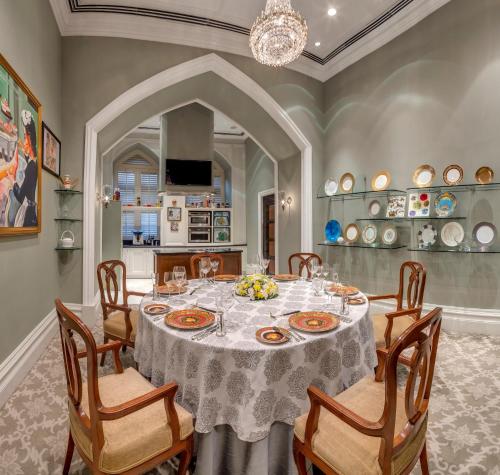 a dining room with a table and chairs at The Taj Mahal Tower, Mumbai in Mumbai