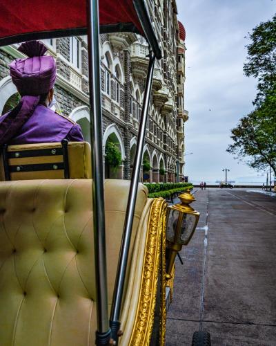 a person is sitting on a bus at The Taj Mahal Tower, Mumbai in Mumbai