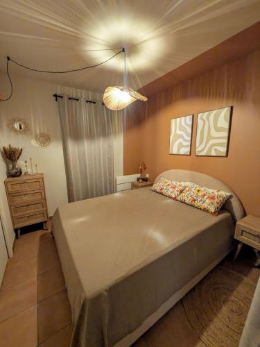 a bedroom with a large bed in a room at Golf apartment in Saumane-de-Vaucluse