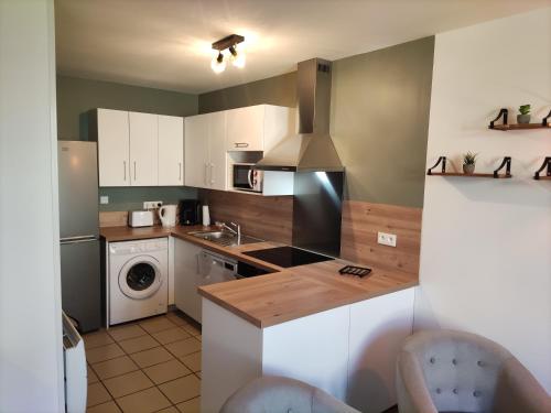 Η κουζίνα ή μικρή κουζίνα στο Chambre avec salle de bain privative